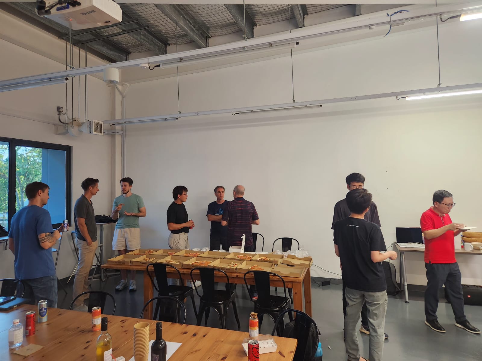 Attendees gathered around the tables at the start of the meetup