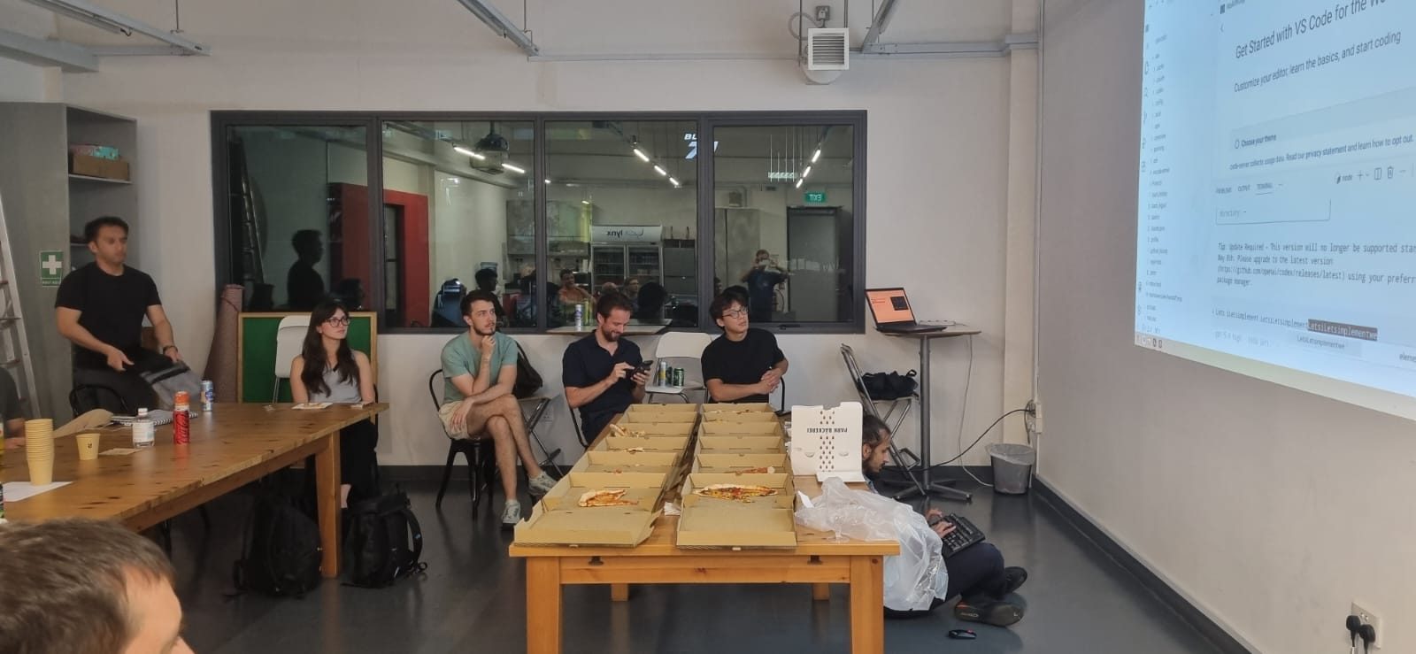 Wide frame of the meetup room during the early setup period