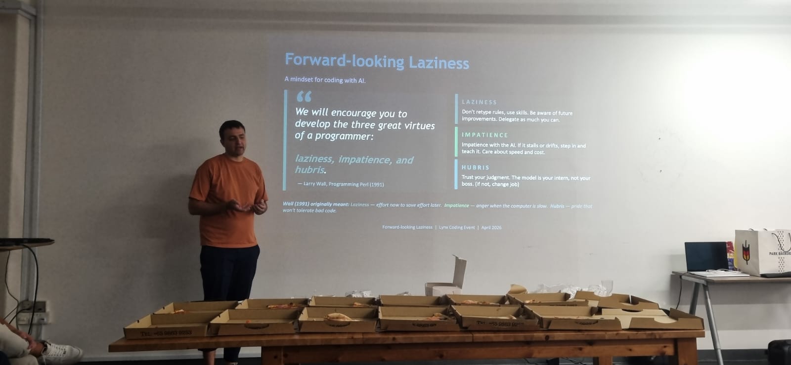 Talk session continuing with slide deck projected on the wall