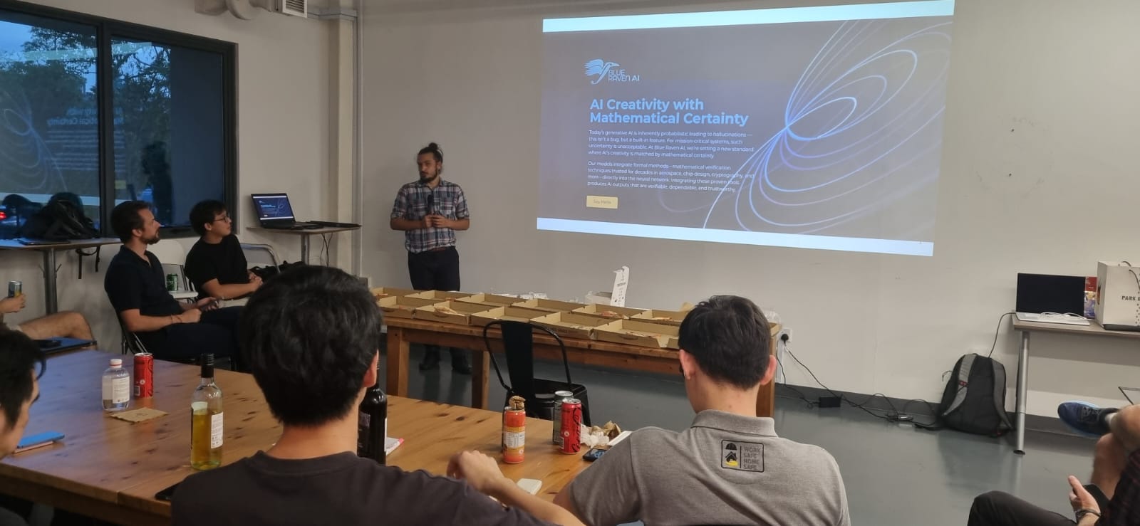 Speaker presenting the Blue Raven AI slide deck